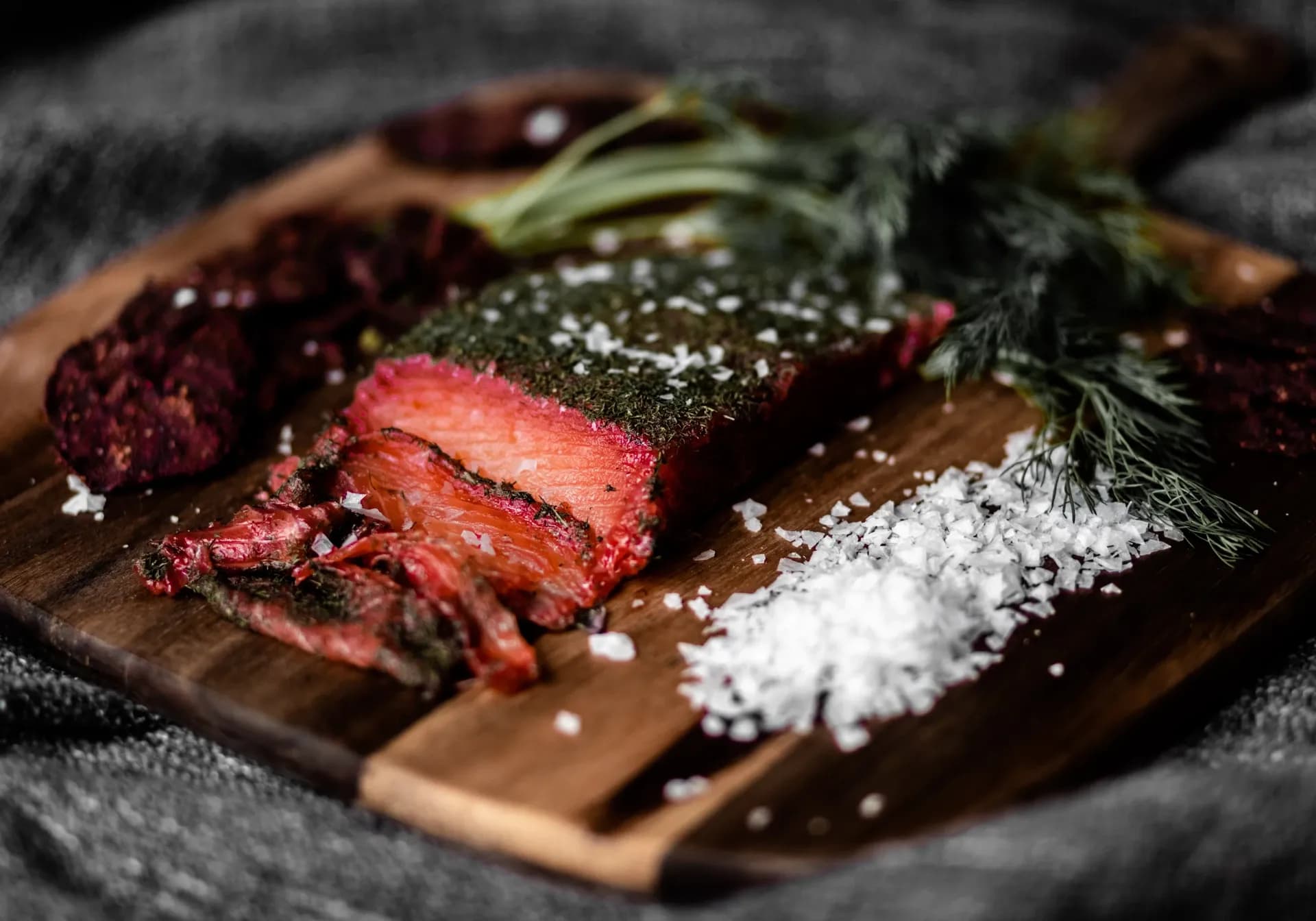 A steak on a chopping board.
